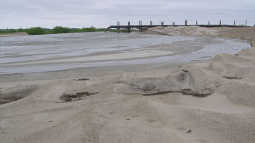 Slurry water pouring from an outlet pipe